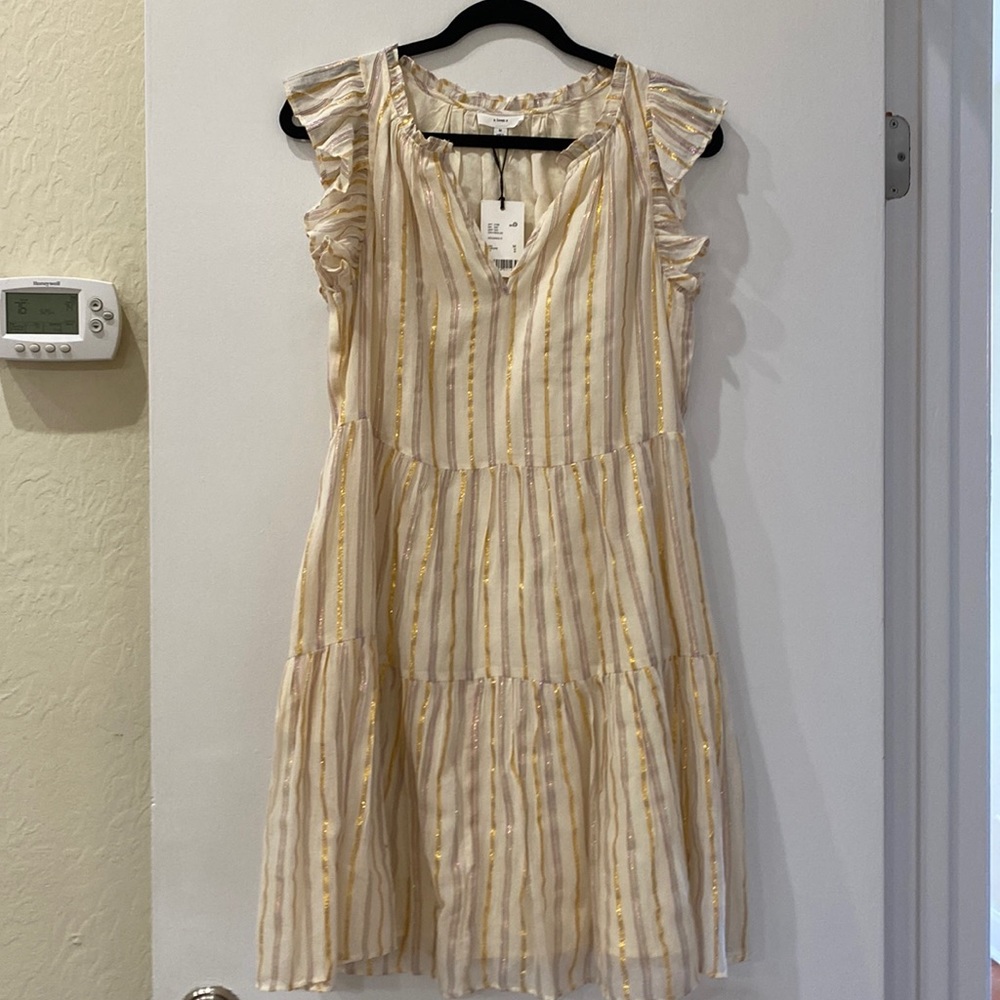Short beige dress with gold and rainbow stripes